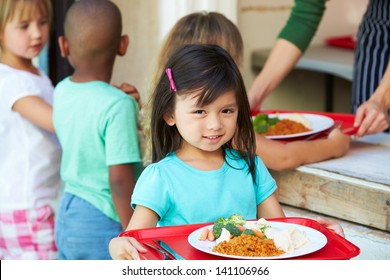 Elementary Pupils Collecting Healthy Lunch In Cafeteria