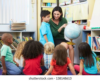 Elementary Pupils In Geography Class With Teacher - Powered by Shutterstock