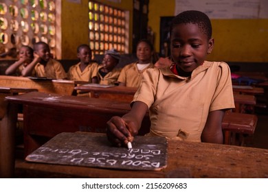 At An Elementary School With Black Schoolchildren In The Classroom. Study Concept.