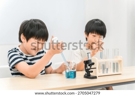 Elementary school boy doing science experiment
