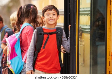 Elementary school boy at the front of the school bus queue