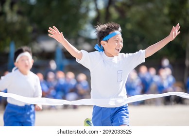 Elementary School Boy Who Wins The First Prize In A Foot Race