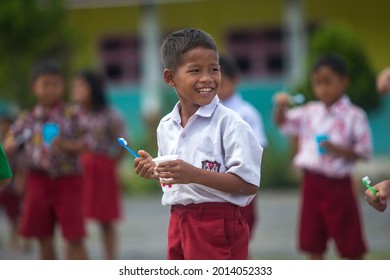 
Elementary School Children Are Directly Practicing How To Brush Their Teeth Properly Taught By A Health Nurse, North Kalimantan-Indonesia.January 16 2019