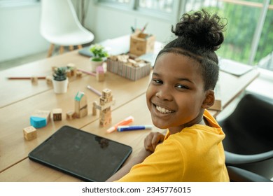 Elementary school children using digital tablet in classroom,Education,Wireless technology and school concept.