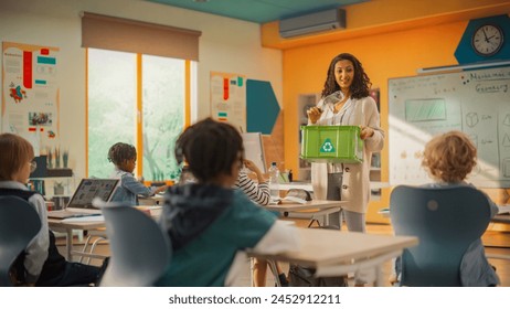 Elementary School Classroom: Enthusiastic Female Teacher Holding an Empty Plastic Bottle and a Box with a Recycling Label and Explaining Ecology and Sustainability Concepts to School Kids - Powered by Shutterstock