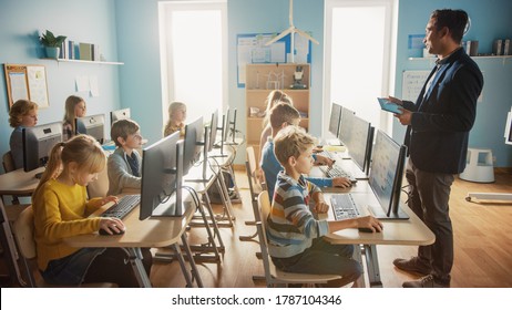 Elementary School Computer Science Classroom: Teacher Uses Tablet Computer, Explains Lesson To Diverse Group Of Smart Children. Informatics Class Kids Learn: Internet Safety, Software Programming