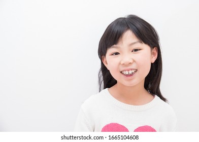 Elementary School Girl Doing Orthodontics