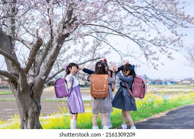 Elementary School Girls Playing On The Way To And From School