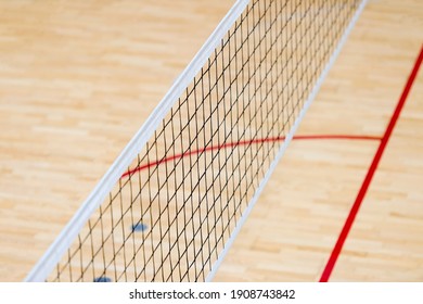Elementary school gym indoor with volleyball net. Team sport concept