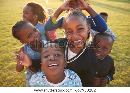 Elementary school kids having fun outdoors, high angle