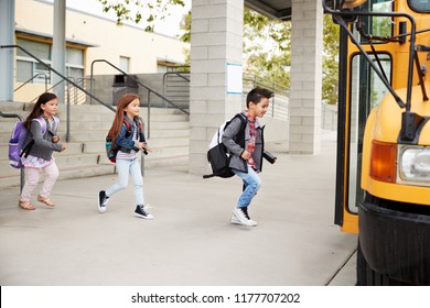 Elementary School Kids Leaving School To Get The School Bus