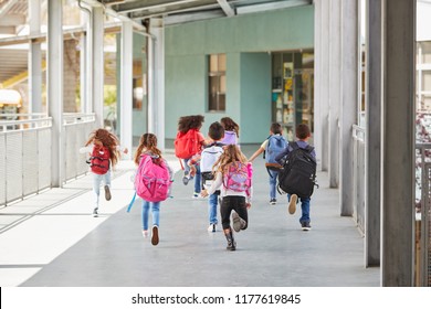 Elementary School Kids Run From Camera In School Corridor