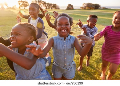 Elementary School Kids Running To Camera Outdoors, Close Up