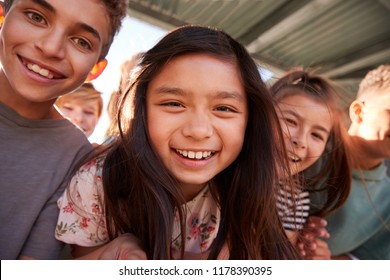 Elementary School Kids Smiling To Camera, Close Up