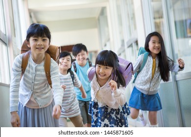 
Elementary School Student Carrying School Bags