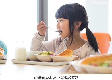 Elementary School Student Eating Lunch