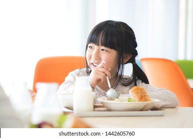 Elementary School Student Eating Lunch