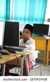 An Elementary School Student Watching A Youtube Video In A Computer Laboratory Owned By The School. Jambi, Indonesia - November 2020.