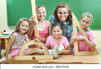 Elementary School Students at Classroom Desks - Shutterstock ID 300219533