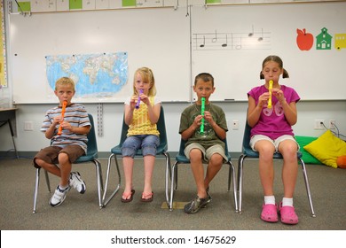 Elementary school students playing flutes - Powered by Shutterstock