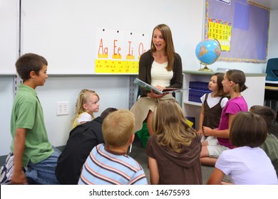 Elementary School Teacher Reads Story To Class