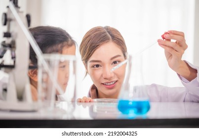 Elementary Science Class, Cheerful Kid Girl With Teacher Scientist In School Laboratory, Science Laboratory