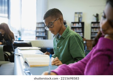 Elementary students reading in library - Powered by Shutterstock - Get 15% off with code: PIKWIZARD15
