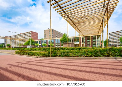 Elementry School In A Neighborhood With Large Apartment Buildings In The Background On A Sunny Summer Day, No People. Palenstein District, Zoetermeer City, The Netherlands