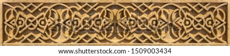 Elements of architectural decoration of buildings, plaster stucco, wall texture, plaster molding and patterns. On the streets in Catalonia, public places.