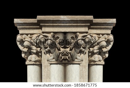 Elements of architectural decorations of buildings, columns and tops, gypsum stucco molding, wall texture and patterns. On the streets in Catalonia, public places.