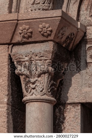 elements of architectural decorations of buildings, columns, pommel and patterns, on the streets in Barcelona, public places.
