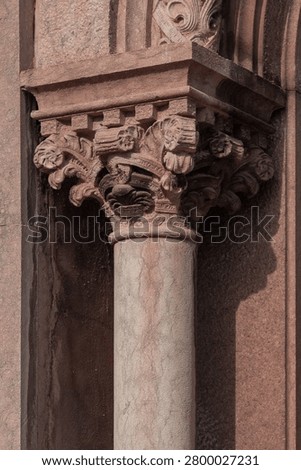 elements of architectural decorations of buildings, columns, pommel and patterns, on the streets in Barcelona, public places.