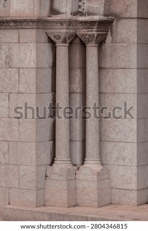 elements of architectural decorations of buildings, columns, pommel and patterns, on the streets in Barcelona, public places.