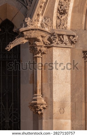 elements of architectural decorations of buildings, columns, pommel and patterns, on the streets in Barcelona, public places.