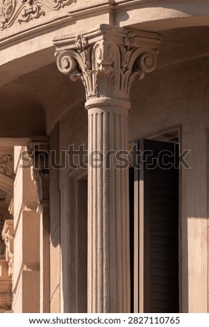 elements of architectural decorations of buildings, columns, pommel and patterns, on the streets in Barcelona, public places.