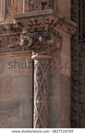 elements of architectural decorations of buildings, columns, pommel and patterns, on the streets in Barcelona, public places.