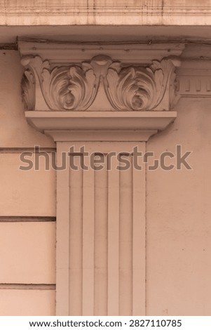 elements of architectural decorations of buildings, columns, pommel and patterns, on the streets in Barcelona, public places.