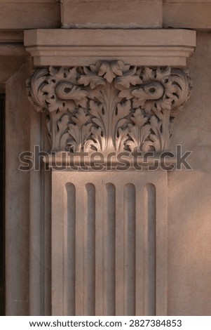elements of architectural decorations of buildings, columns, pommel and patterns, on the streets in Barcelona, public places.