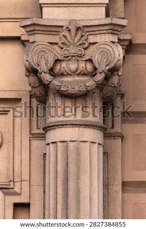 elements of architectural decorations of buildings, columns, pommel and patterns, on the streets in Barcelona, public places.