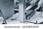 Elements of cardboard boxes are collected in stack. Conveyor line for the production of boxes. Machine cuts cardboard boxes from sheets of cardboard. Enterprise for  production package.