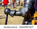 Elements of medieval iron knight armor for battle, helmet, spaulders, pouldrons, vambraces, gauntlets