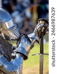 Elements of medieval iron knight armor for battle, helmet, spaulders, pouldrons, vambraces, gauntlets