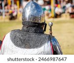 Elements of medieval iron knight armor for battle, helmet, spaulders, pouldrons, vambraces, gauntlets