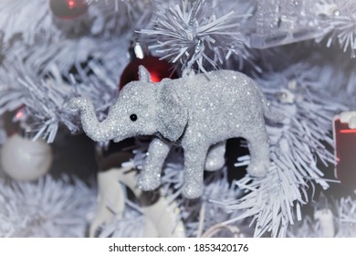 Elephant Christmas decoration on a white Christmas tree