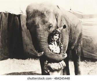 Elephant Embracing Circus Performer