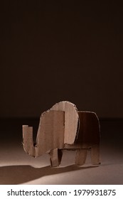 Elephant Made Of Cardboard On A Dark Background. Children Art Project. DIY Concept. Cardboard Craft.