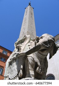 Elephant and Obelisk sculpture by Bernini in Rome, Italy, Piazza della Minerva, from low angle against a blue sky
