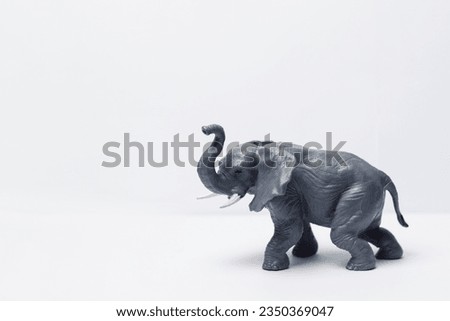 an elephant plastic toy on a white background