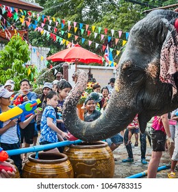 Elephant splashing water during Songkran Festival on Apr 13, 2013 in Ayutthaya, Thailand. Initiated by Tourism Authority of Thailand, elephants take part in the festival to give revelers more fun.