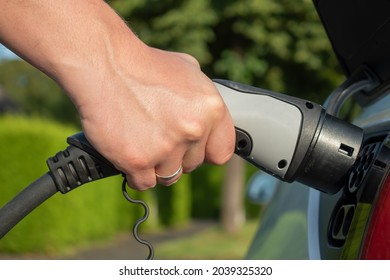 Eletric car charging fuel plug  - Shutterstock ID 2039325320